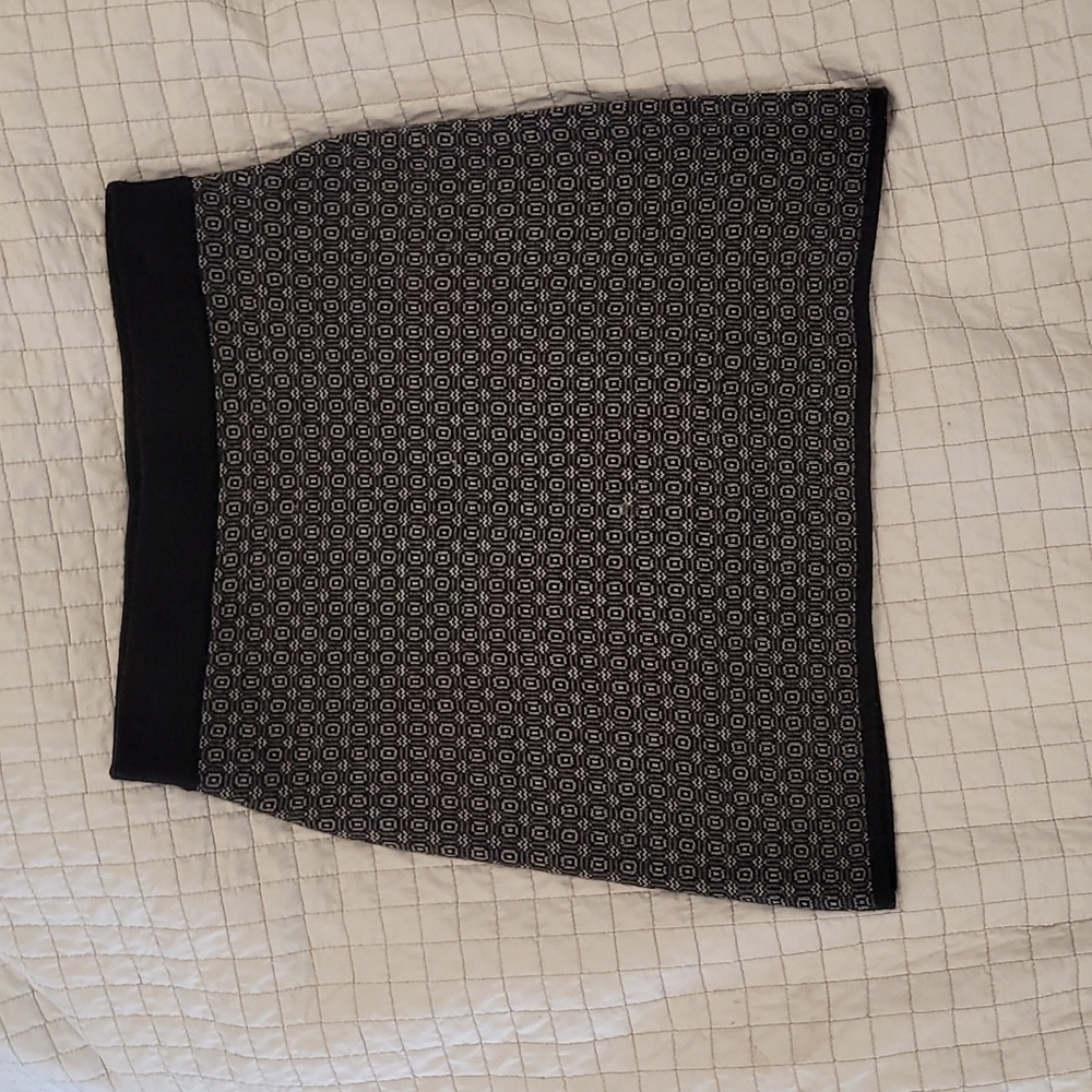 Knee length black and white patterned skirt